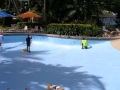 Pool paint being applied to resort pool